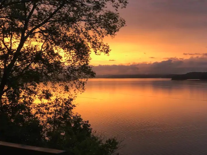 scenic view of a lake with the east tennessee mountains in the distance