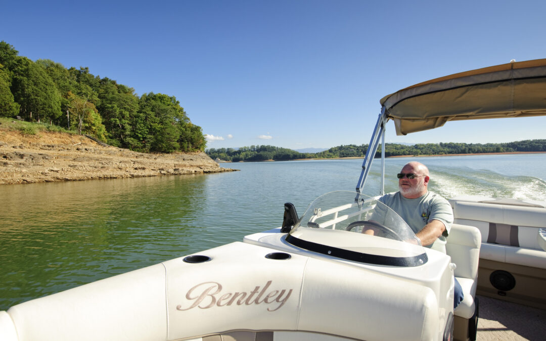 Man driving boat on East Tennessee lake