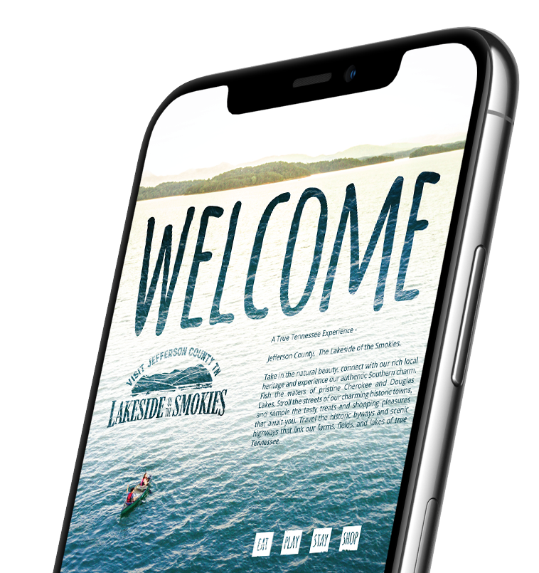 mock up of a cell phone with the lakeside of the smokies jefferson county tennessee brochure pulled up on it