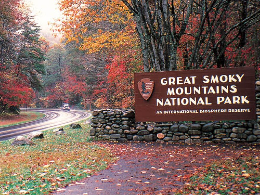 Sign of the Great Smoky Mountains National Park with fall foliage surrounding it