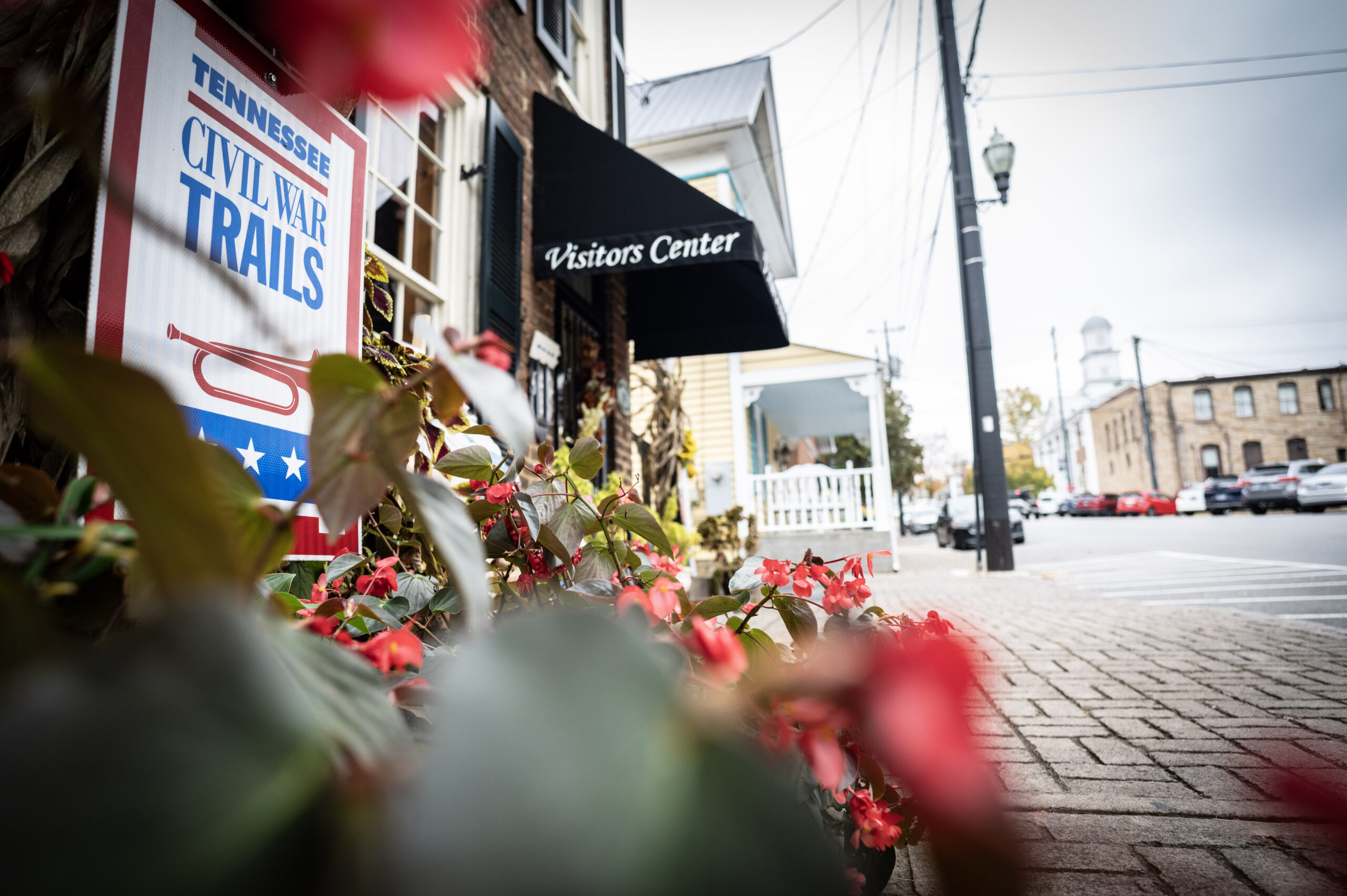 girls walking down historic street talking and enjoying the town