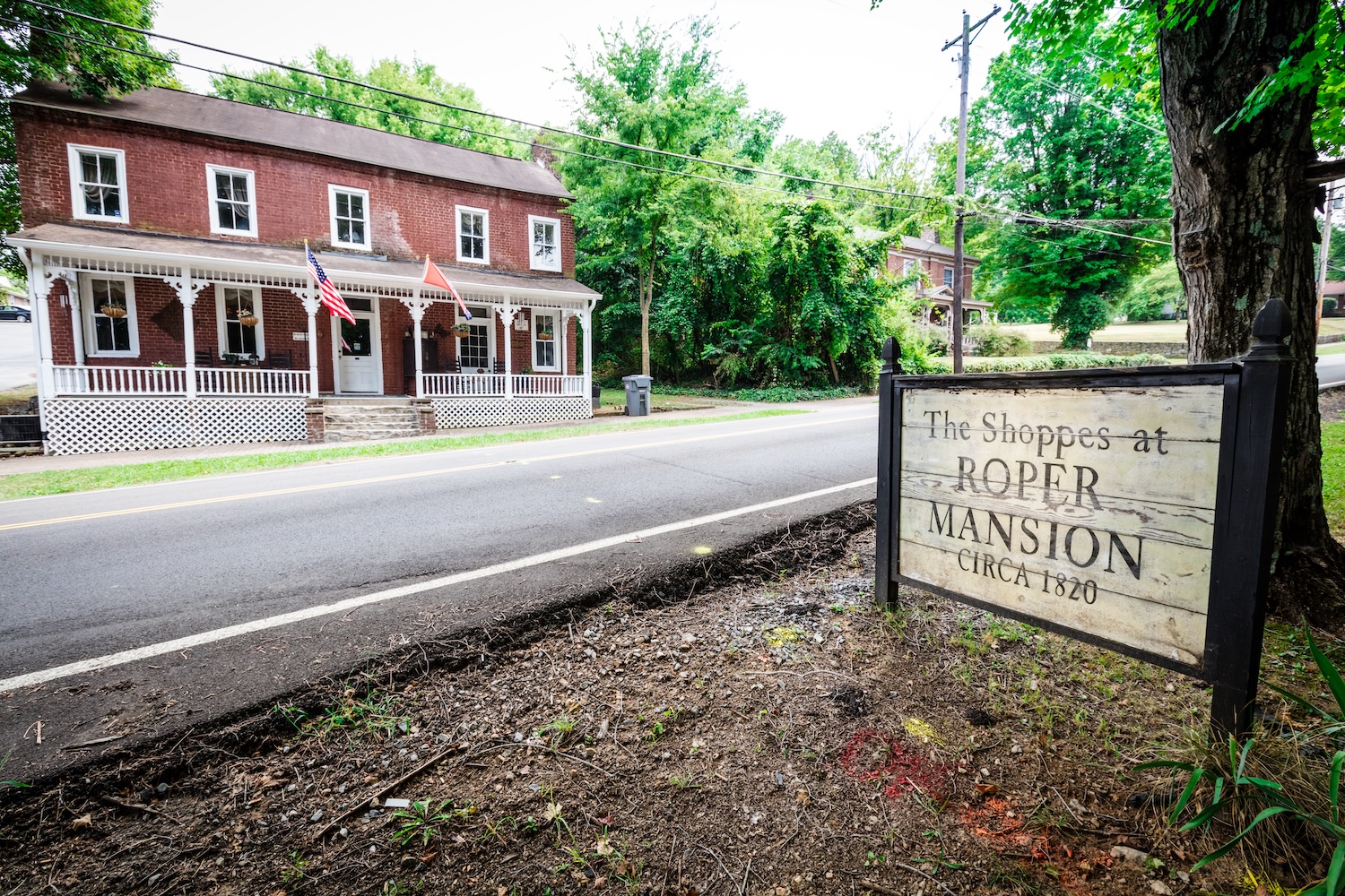 Historic building with signage and flags