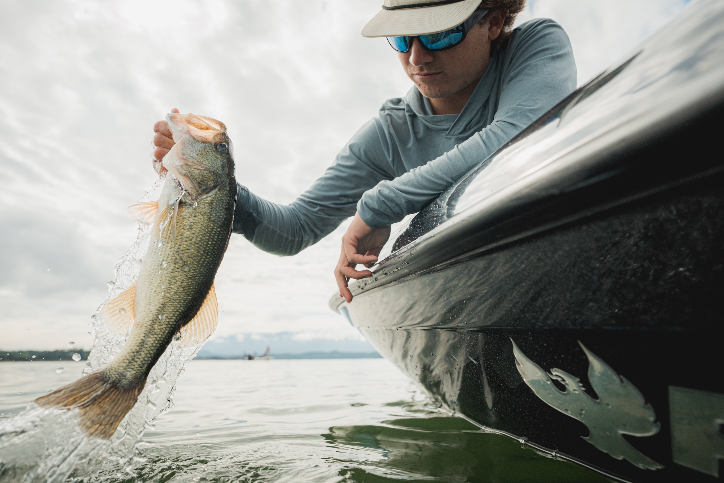 Person holding a largemouth bass caught on Douglas Lake