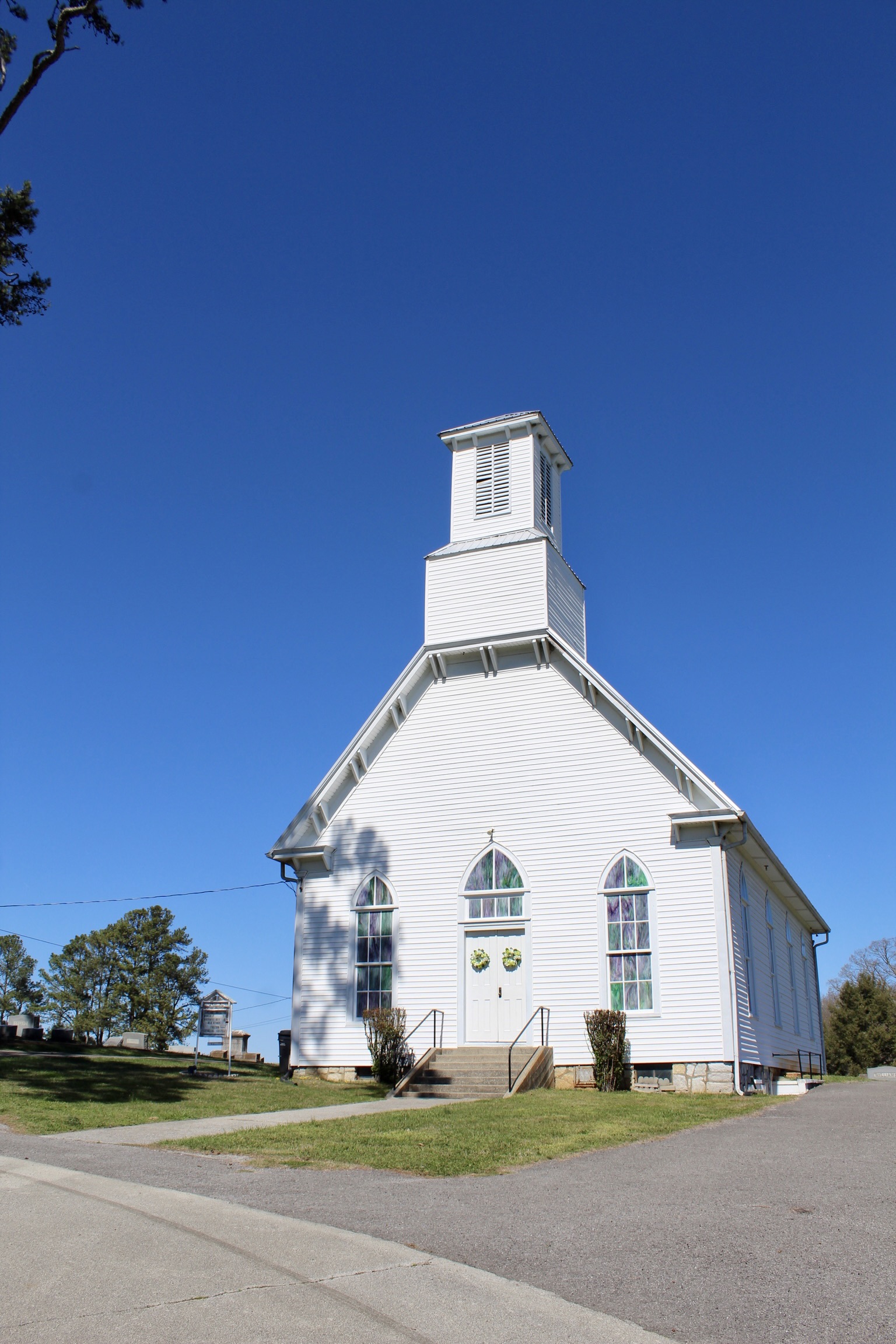 Historic building with signage and flags