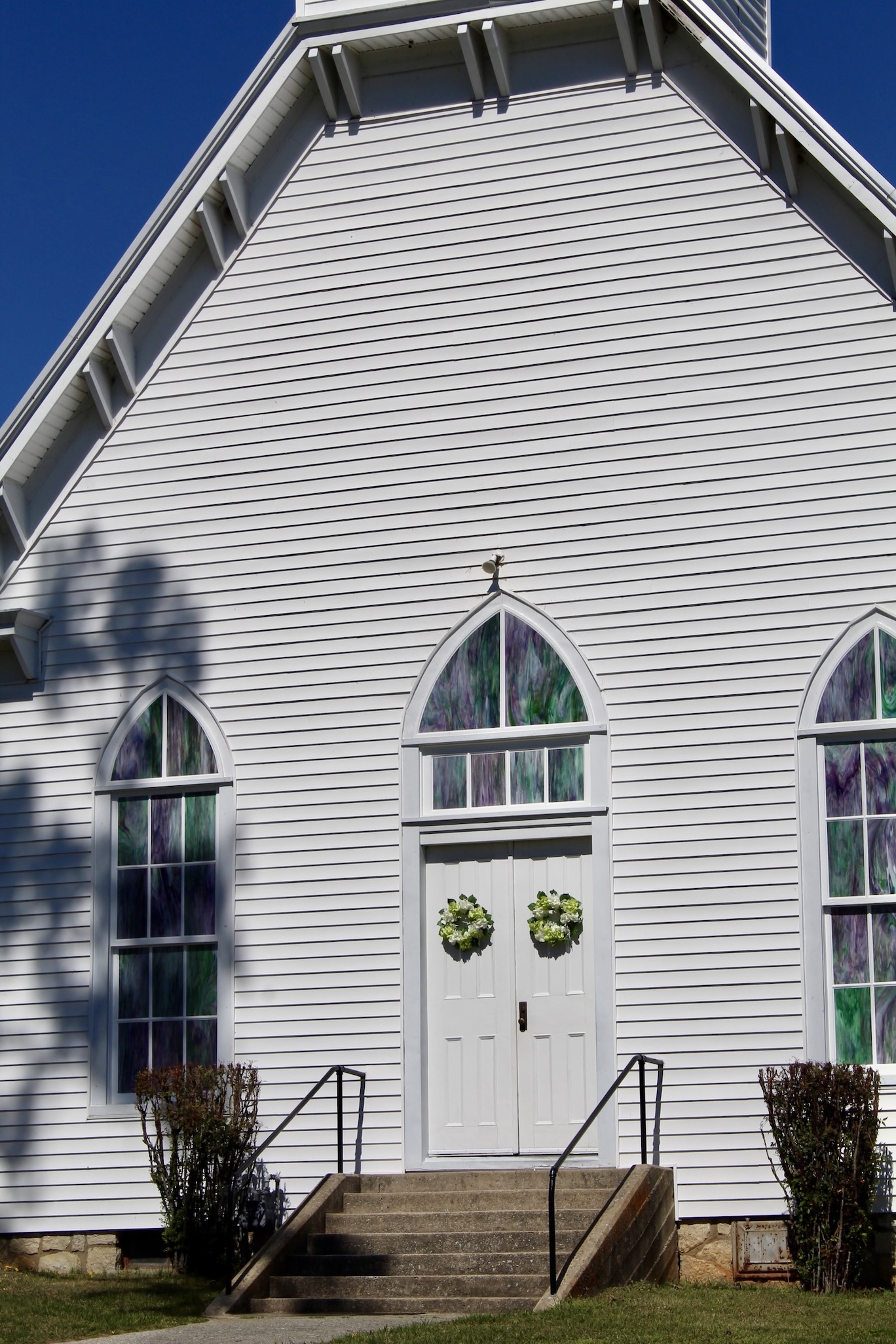 Historic building with signage and flags