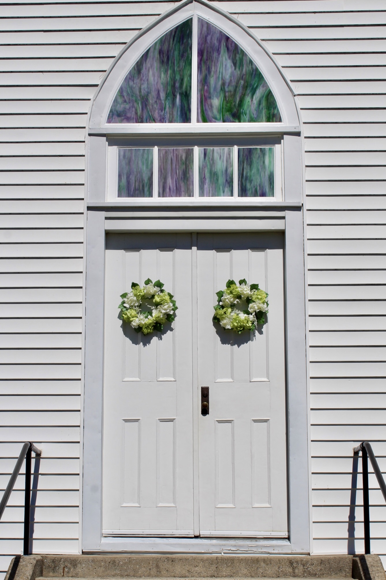 Historic building with signage and flags