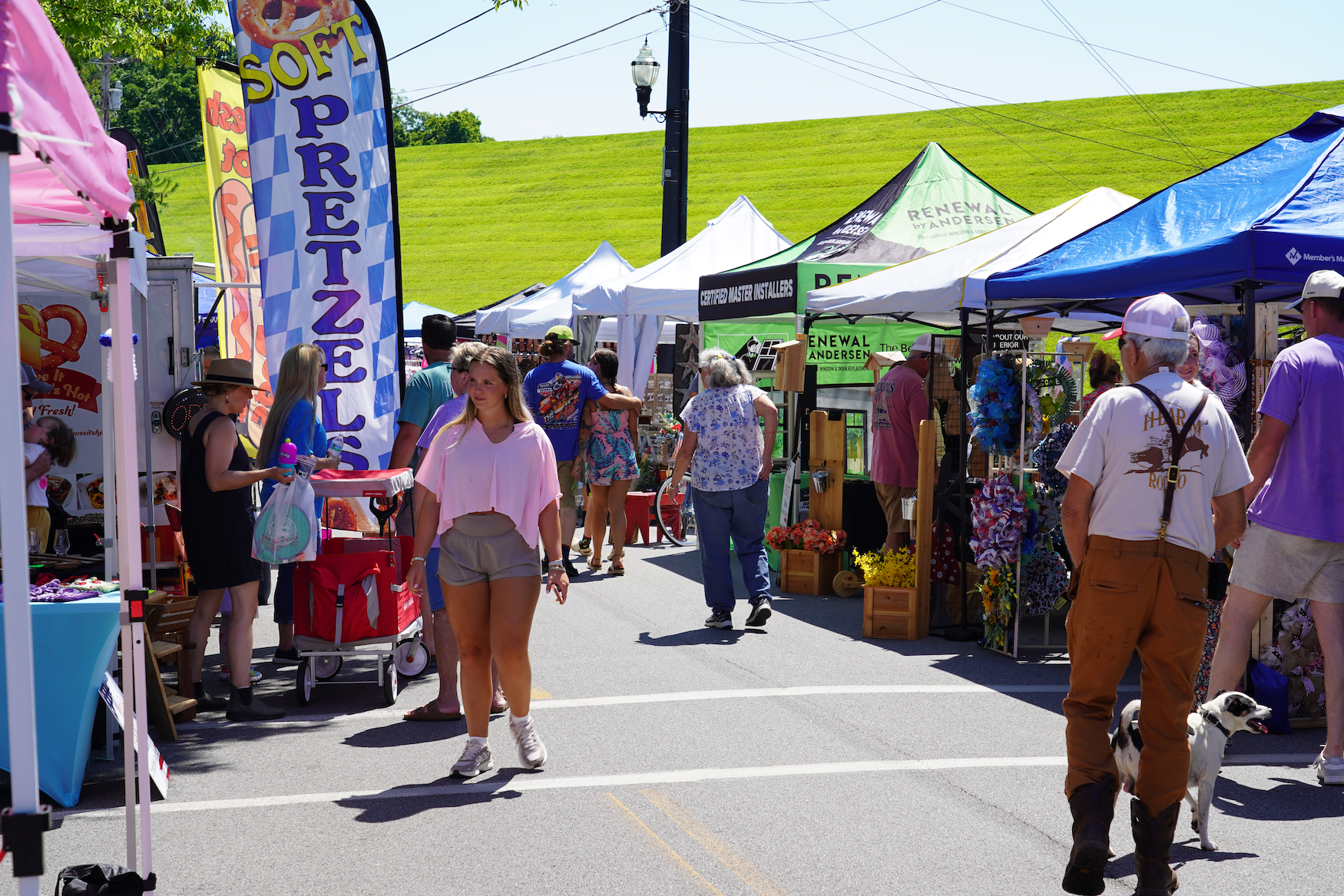 Busy outdoor market with colorful tents