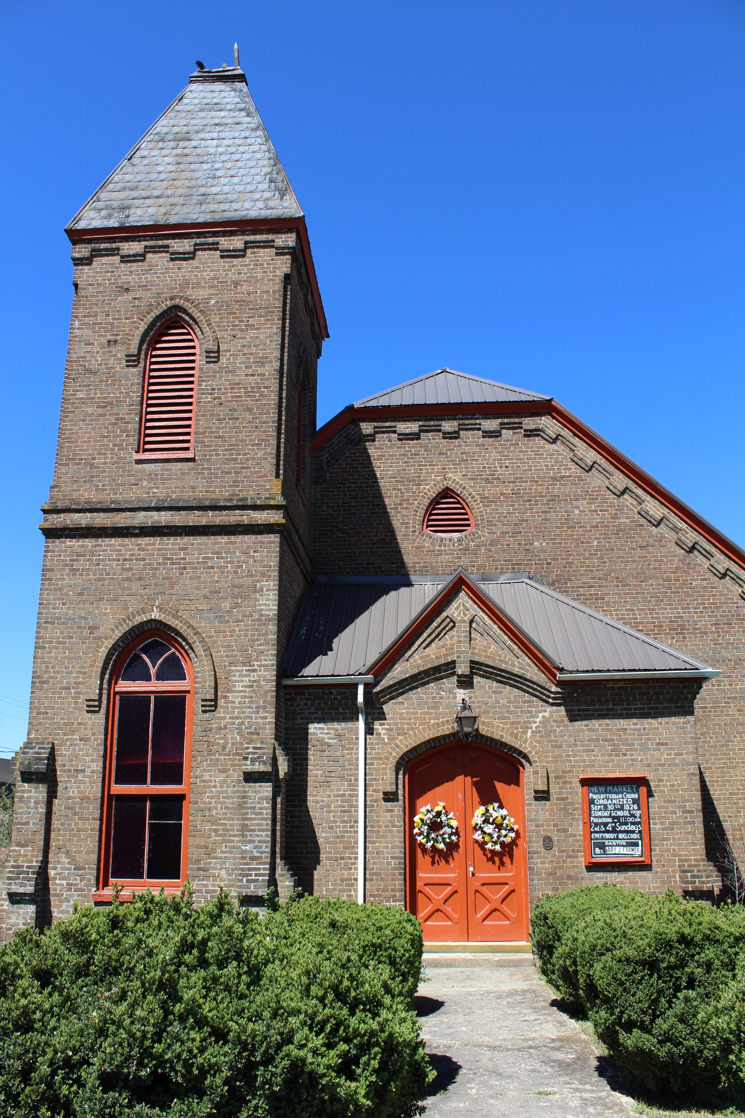 Two women reading a sign in front of the historic vistors center in Dandridge, TN