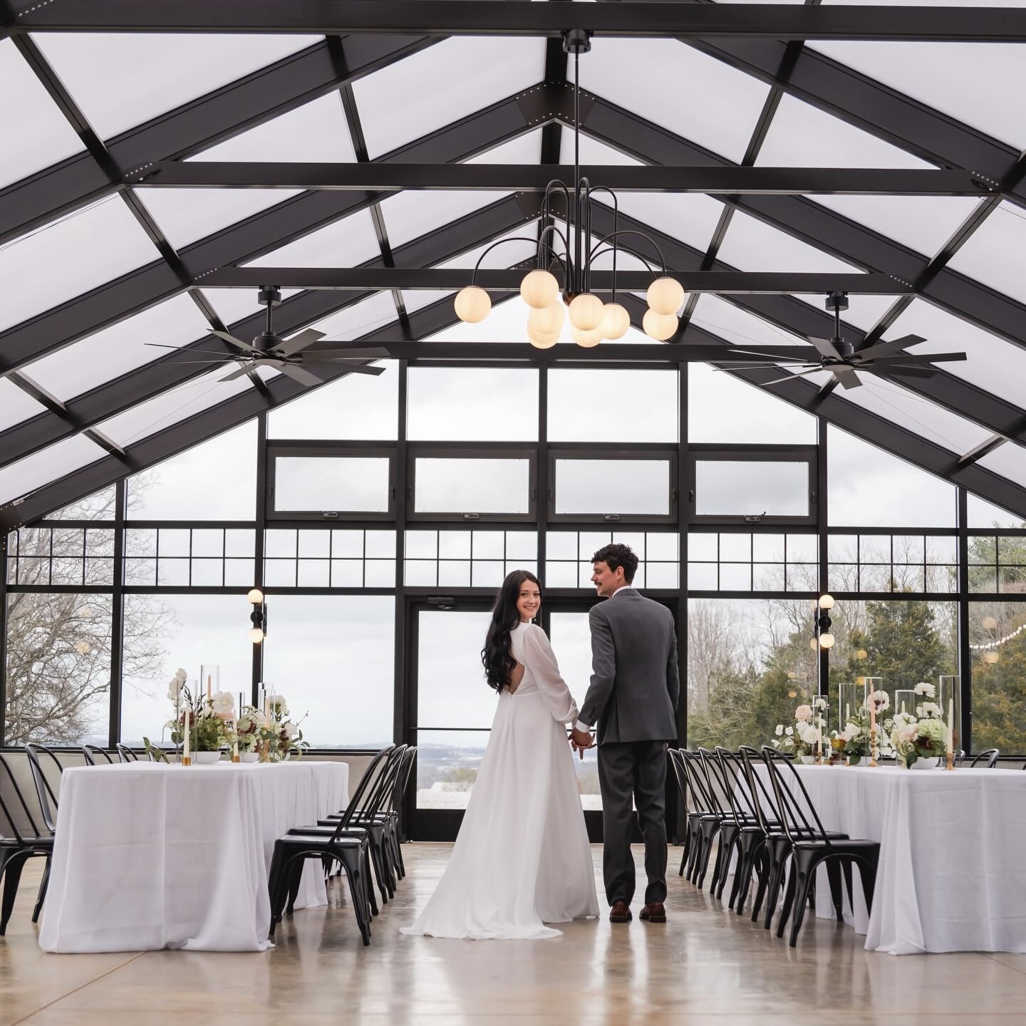 Couple holding hands in elegant venue